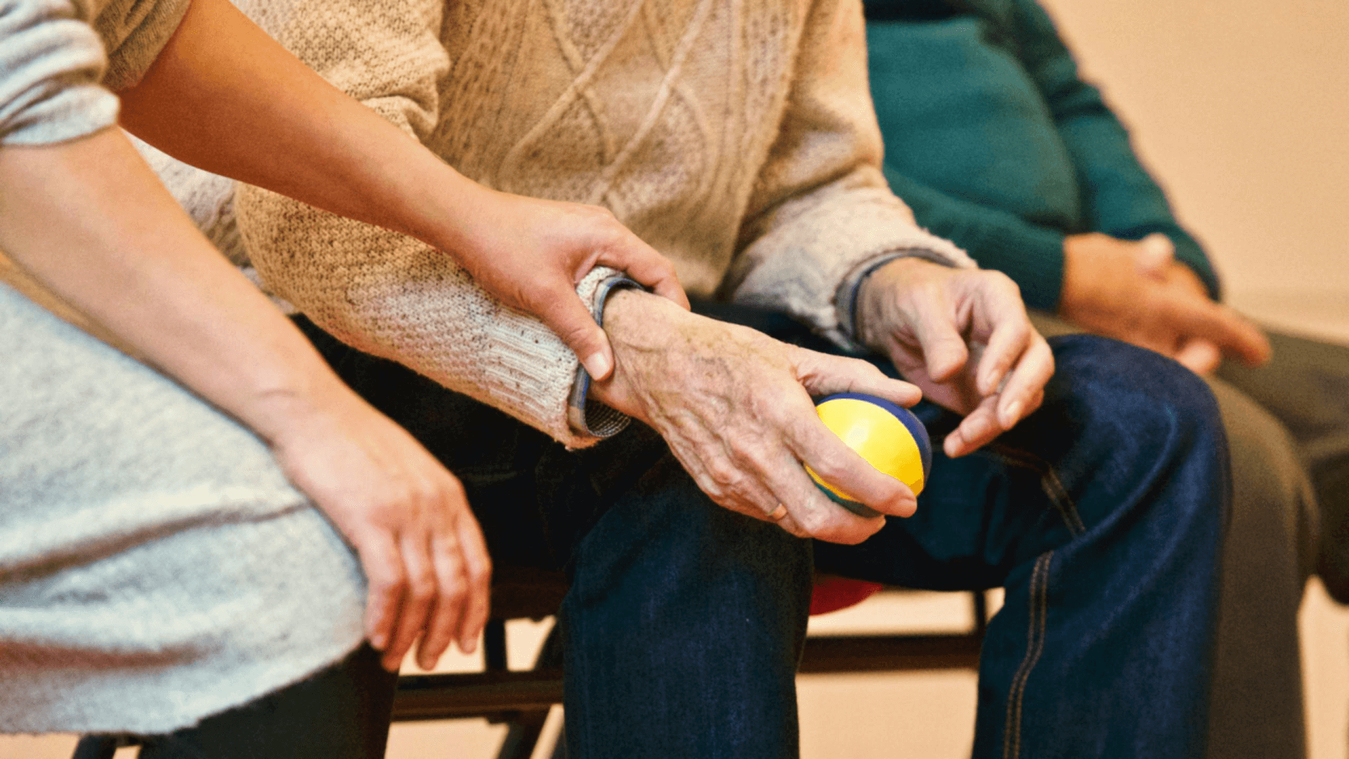 An older couple holding hands