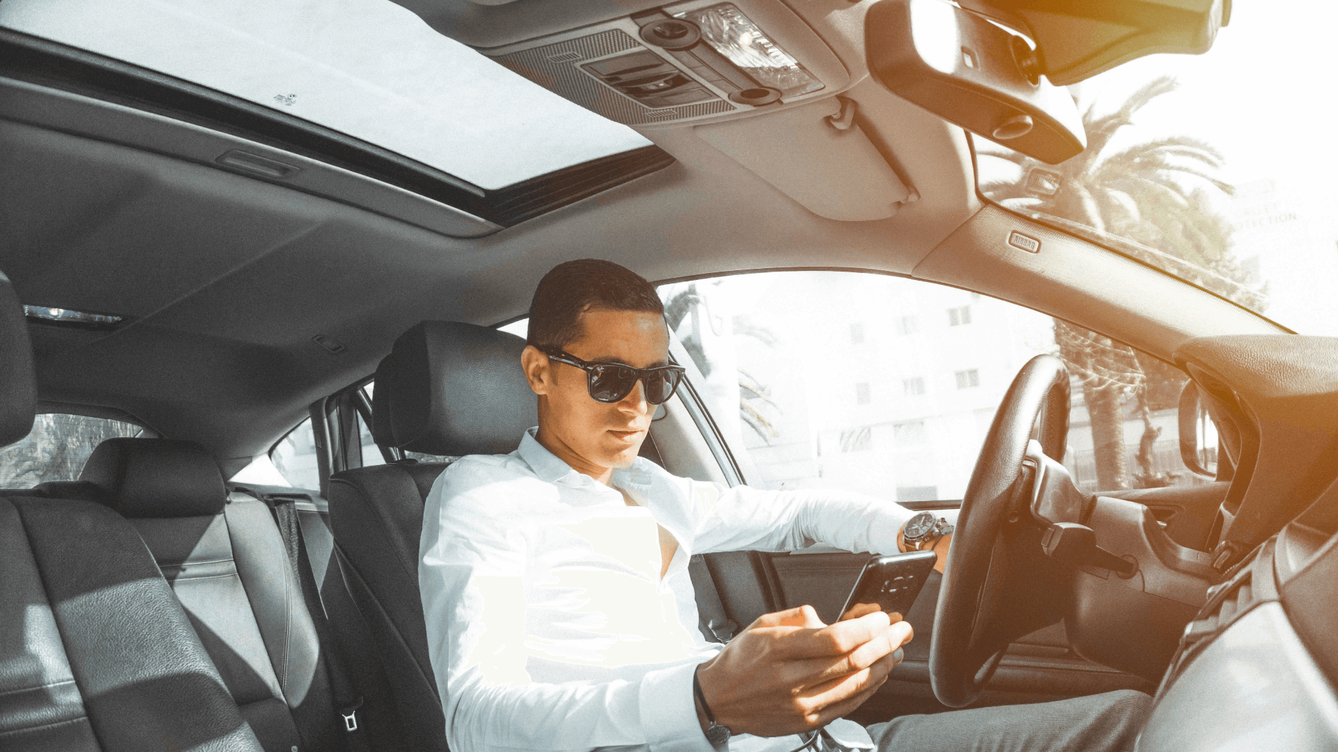 A young man texting while driving