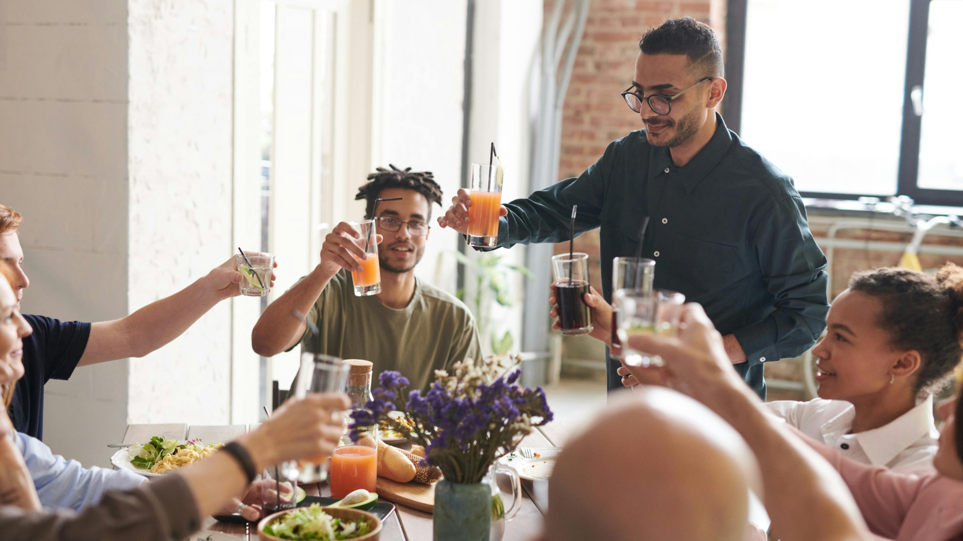 A group of friends and family at a dinner party