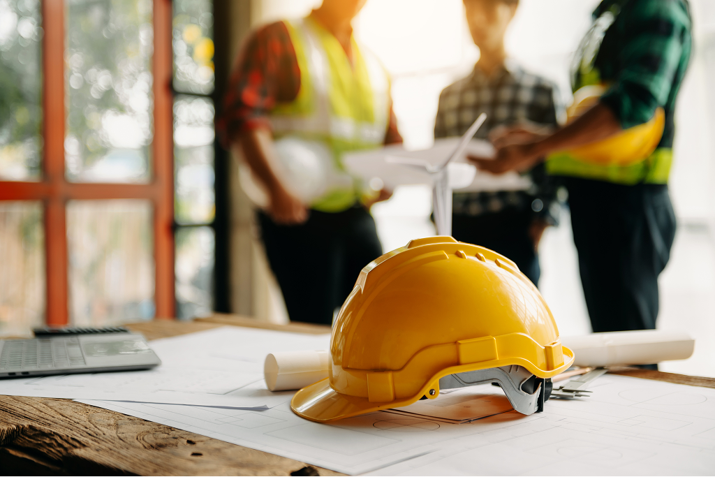 Yellow hard hat on a table at a construction site