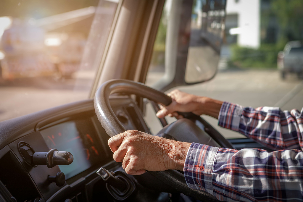 a man driving a semi-truck