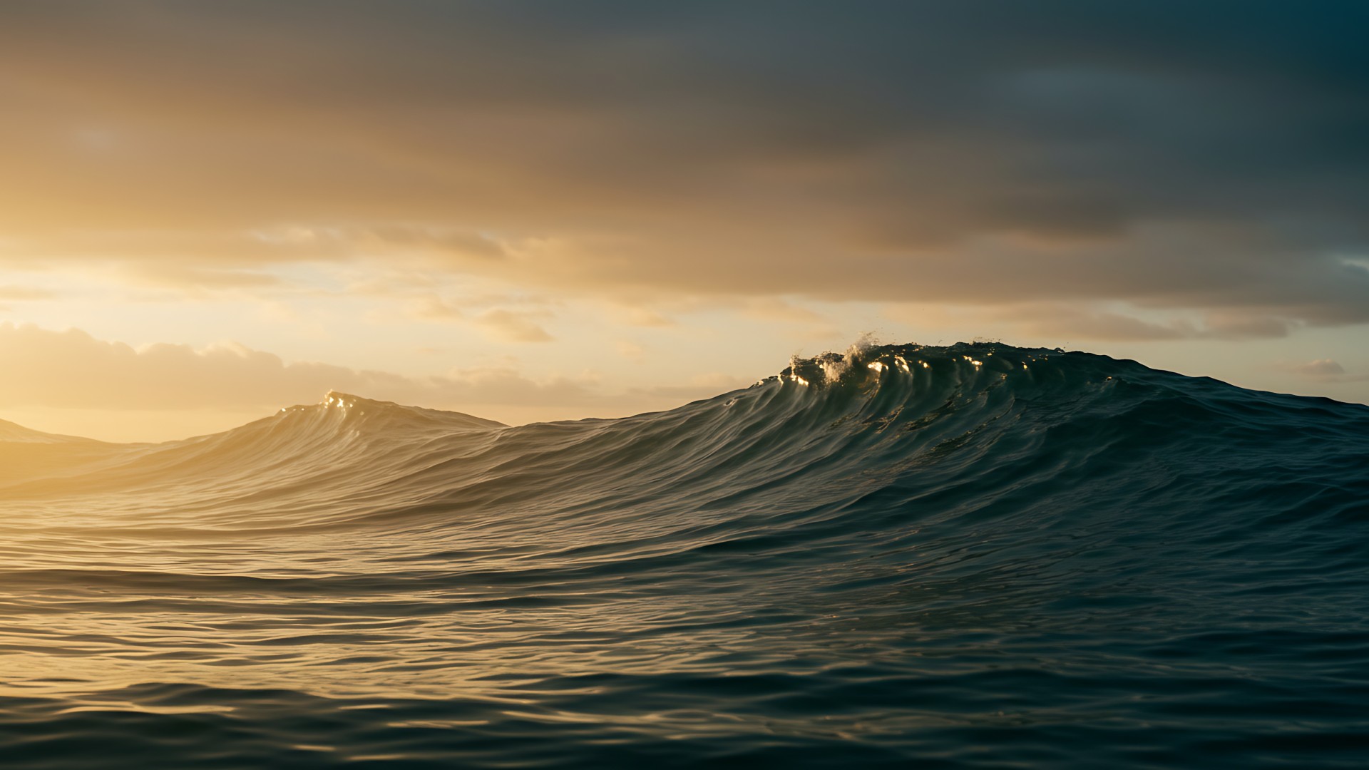 Ocean waves rolling beneath a dramatic golden sunset with sunlight reflecting across the water.