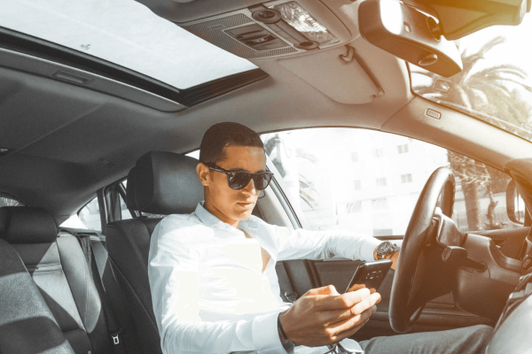 A young man texting while driving