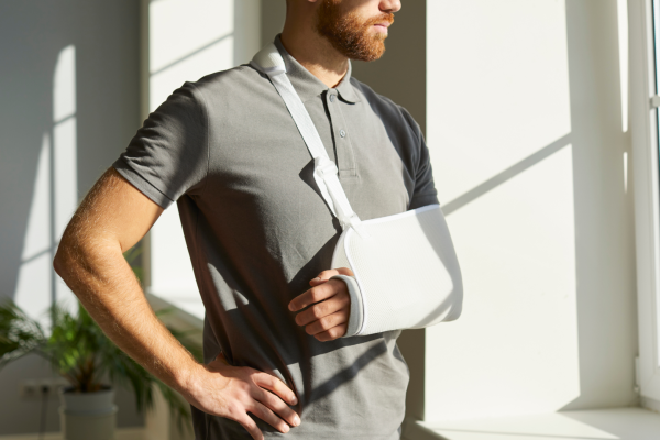 man in a arm sling
